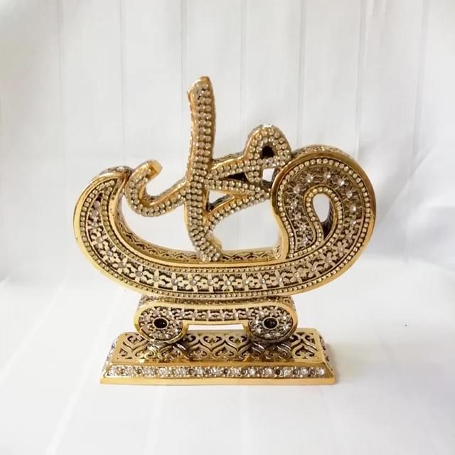 Gold-painted Islamic trinkets made in Turkey with detailed calligraphy.