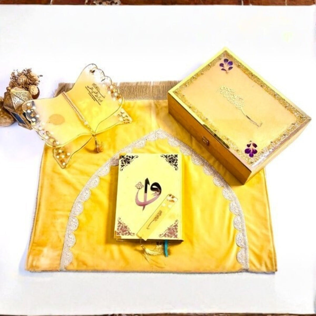 Barkat-e-Jariyah gift box in golden hues with Quran, bookmark, and prayer essentials.
