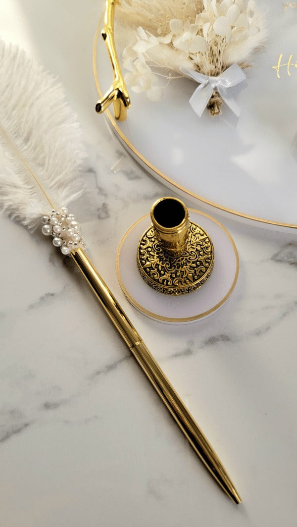 Islamic wedding accessories — luxury feather pen, gold pen stand, and floral resin ring tray