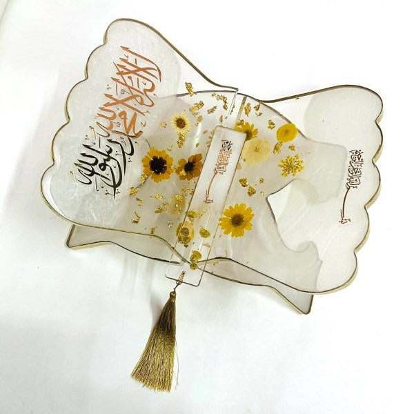 “Handcrafted resin Quran rehal with real pressed flowers and gold detailing”