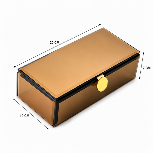 A rectangular transparent smoky-gold storage box with a hinged lid, black trim, and a round gold clasp, shown with dimension arrows and labels indicating 20 cm length, 10 cm width, and 7 cm height on a white background.