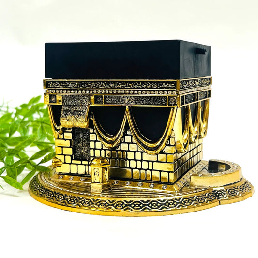 Elegant gold and black Kaaba replica table decor with Swarovski crystals.