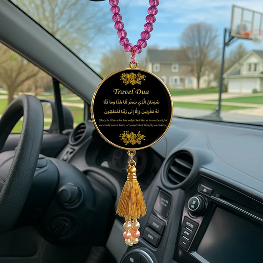 Islamic car hanger with Travel Dua in gold calligraphy on black resin pendant, decorated with pink and peach beads, gold tassel, and pearl accents.