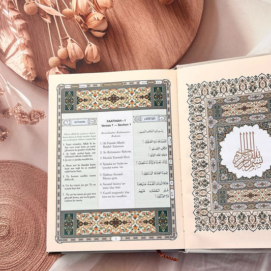 Off-white velvet hardcover Quran with Roman Urdu script and English translation.