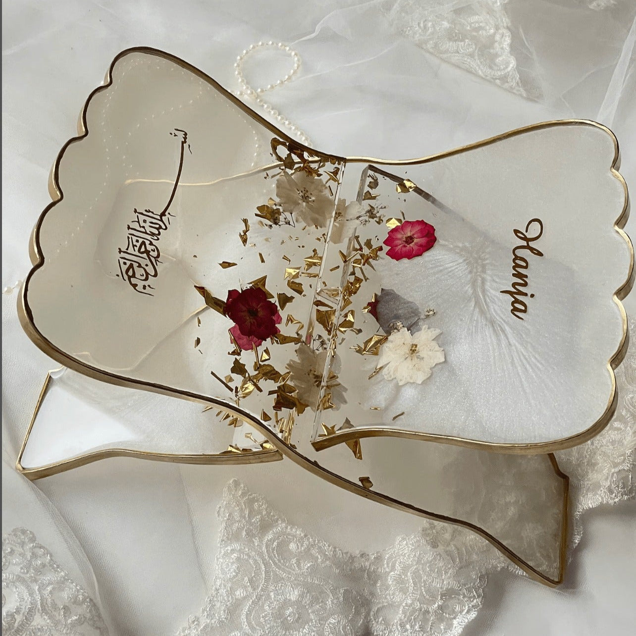 quran book stand handmade with white and pink dried flowers