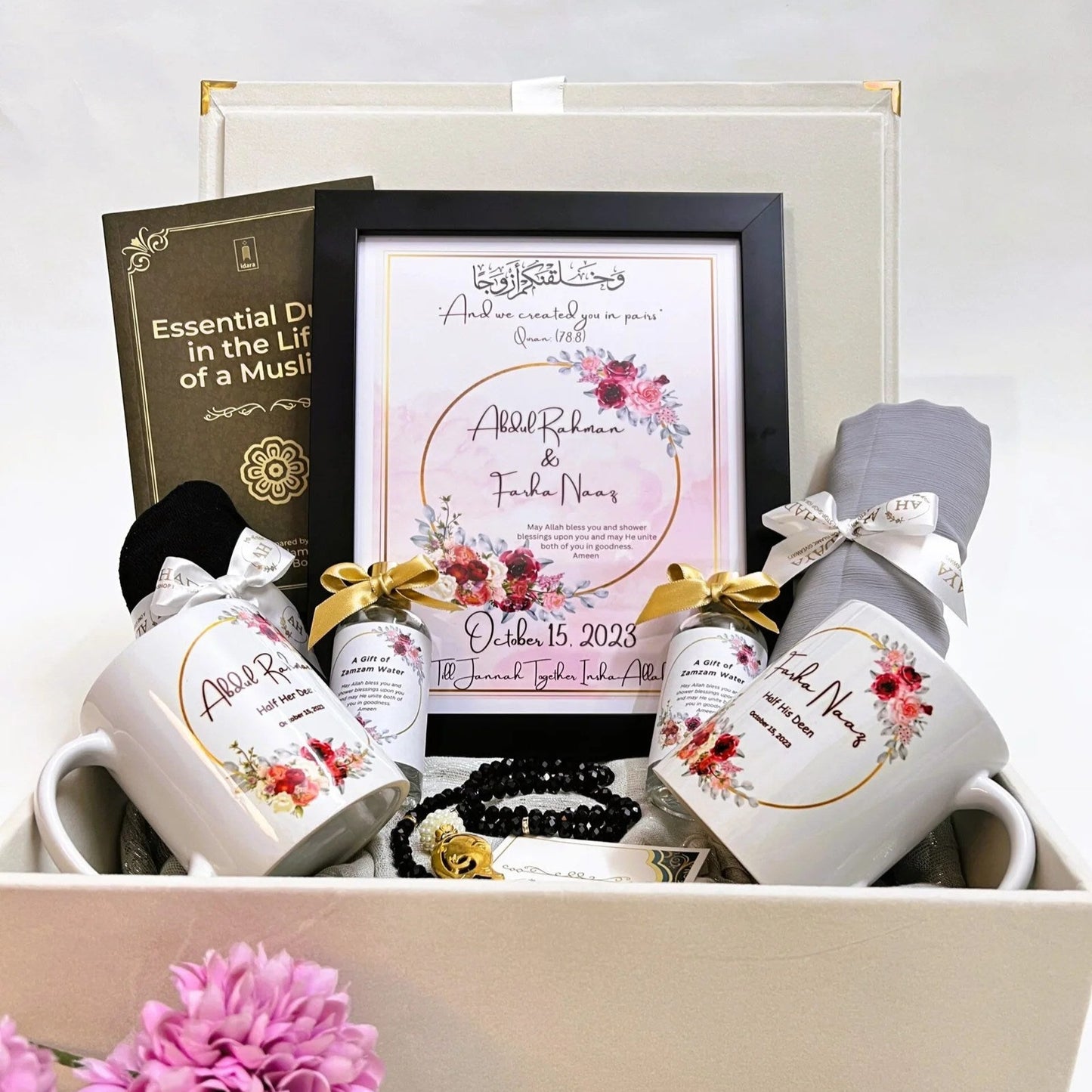 a premium Islamic wedding gift featuring Zamzam water, custom frame, mugs, scarf, topi, and tasbih in a velvet keepsake box.