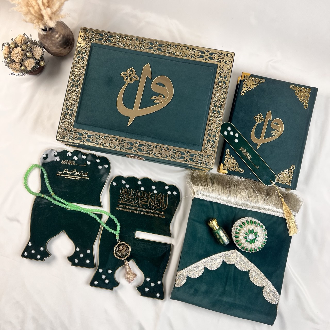Premium green Quran gift set from Al-Hadaya’s Hubb Al-Iman Collection featuring velvet Quran, Turkish prayer mat, tasbih, and attar.