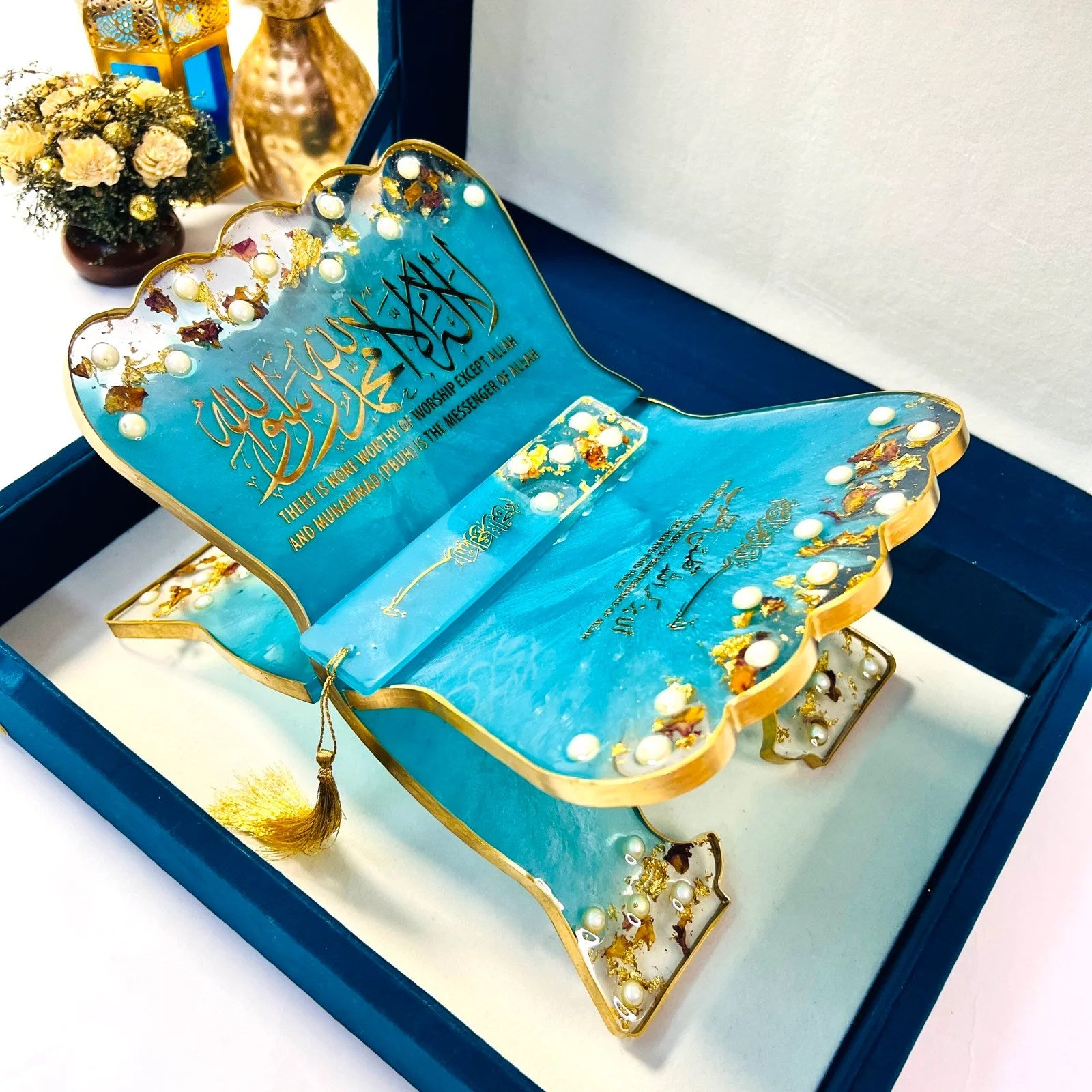 Premium turquoise Quran gift set from Al-Hadaya’s Hubb Al-Iman Collection featuring velvet Quran, prayer mat, tasbih, and attar.
