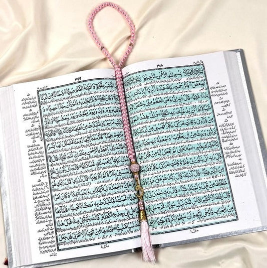 Luxurious off-white velvet Quran with Arabic to Urdu translation and golden detailing.