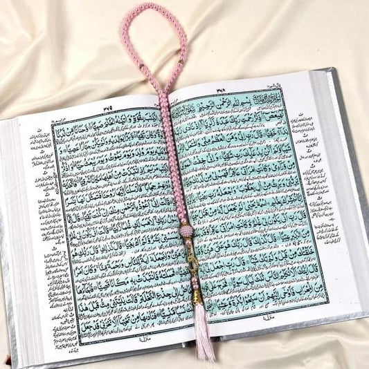 Luxurious off-white velvet Quran with Arabic to Urdu translation and golden detailing.