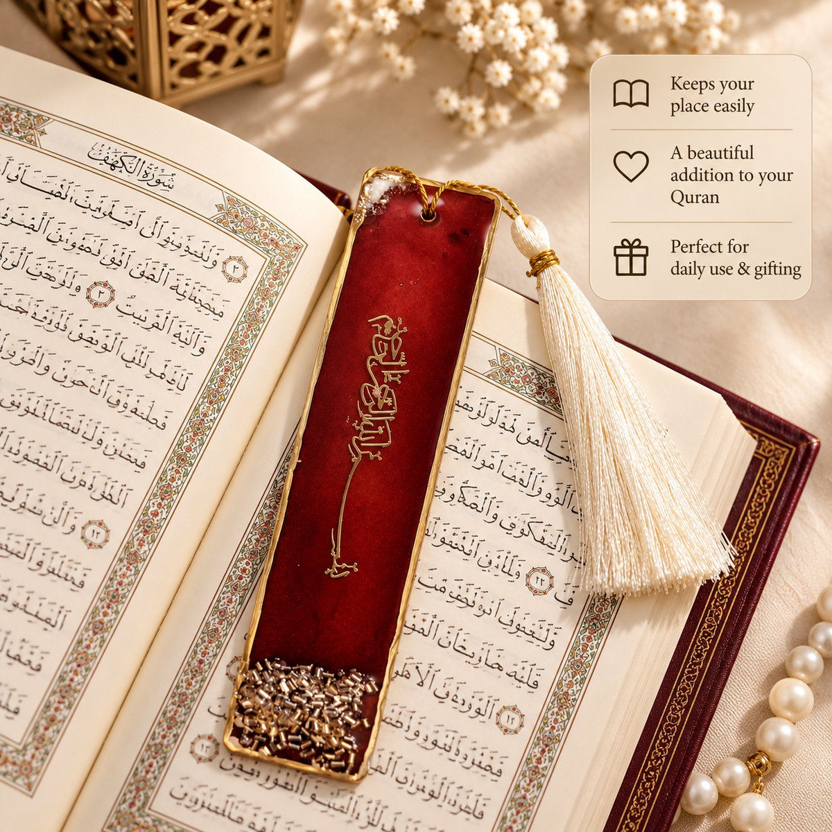 A red leather bookmark with gold Arabic calligraphy and a cream tassel, placed on an open Quran. The image includes a feature callout box on the right with text about keeping place, adding to Quran, and daily use/gifting.