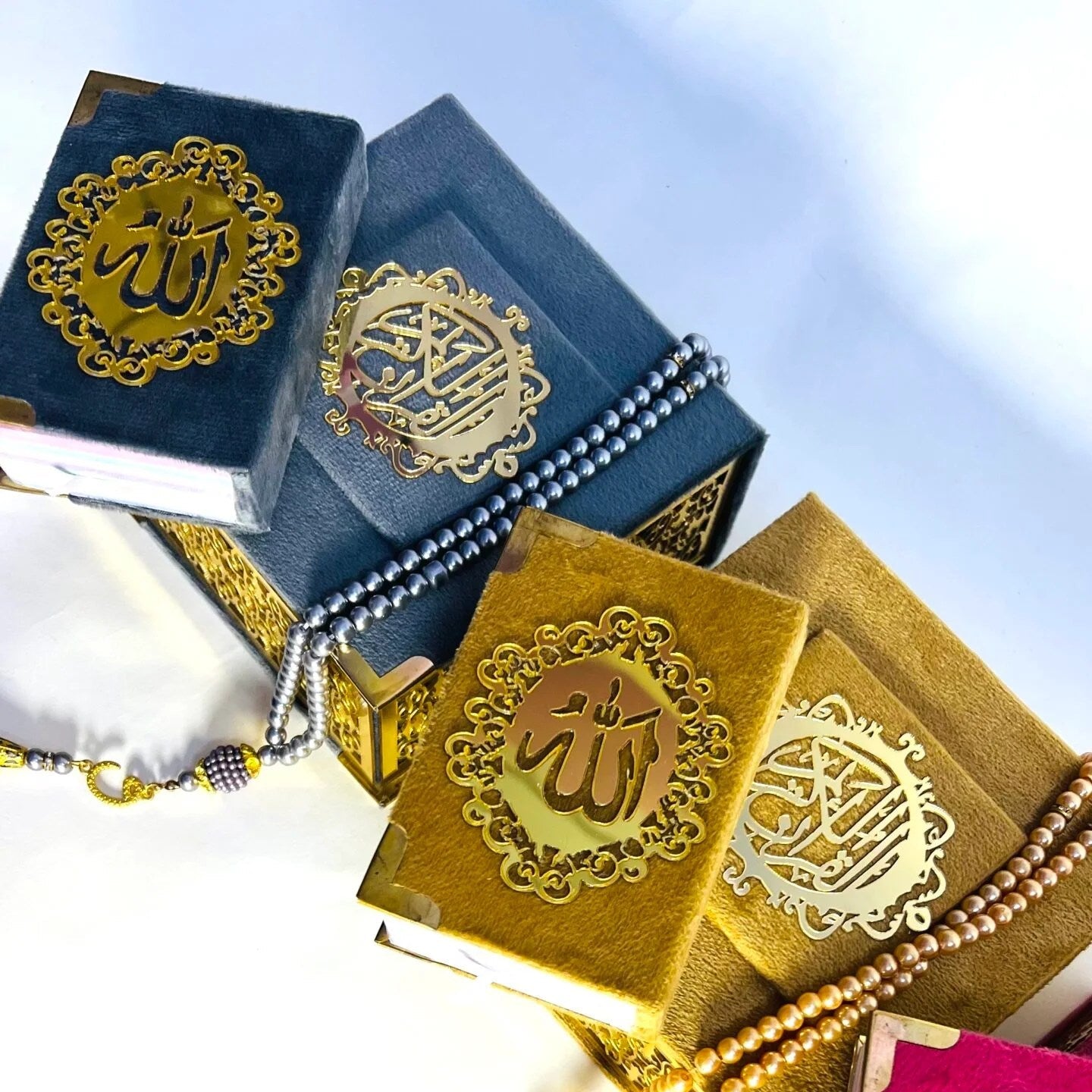 Elegant grey and golden Islamic mini Quran gift set with pearl tasbih and velvet packaging.