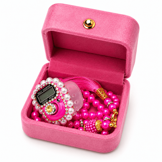 Pink velvet set with digital tally counter and beads in an open pink box on a white background