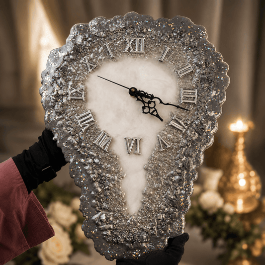 Decorative clock with gemstone-like embellishments held by a person in a festive setting.