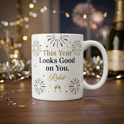 White Ceramic New Year Mug with Gold This Year Text, Looks Good on You Typography, Custom Name Script, and Fireworks Illustrations