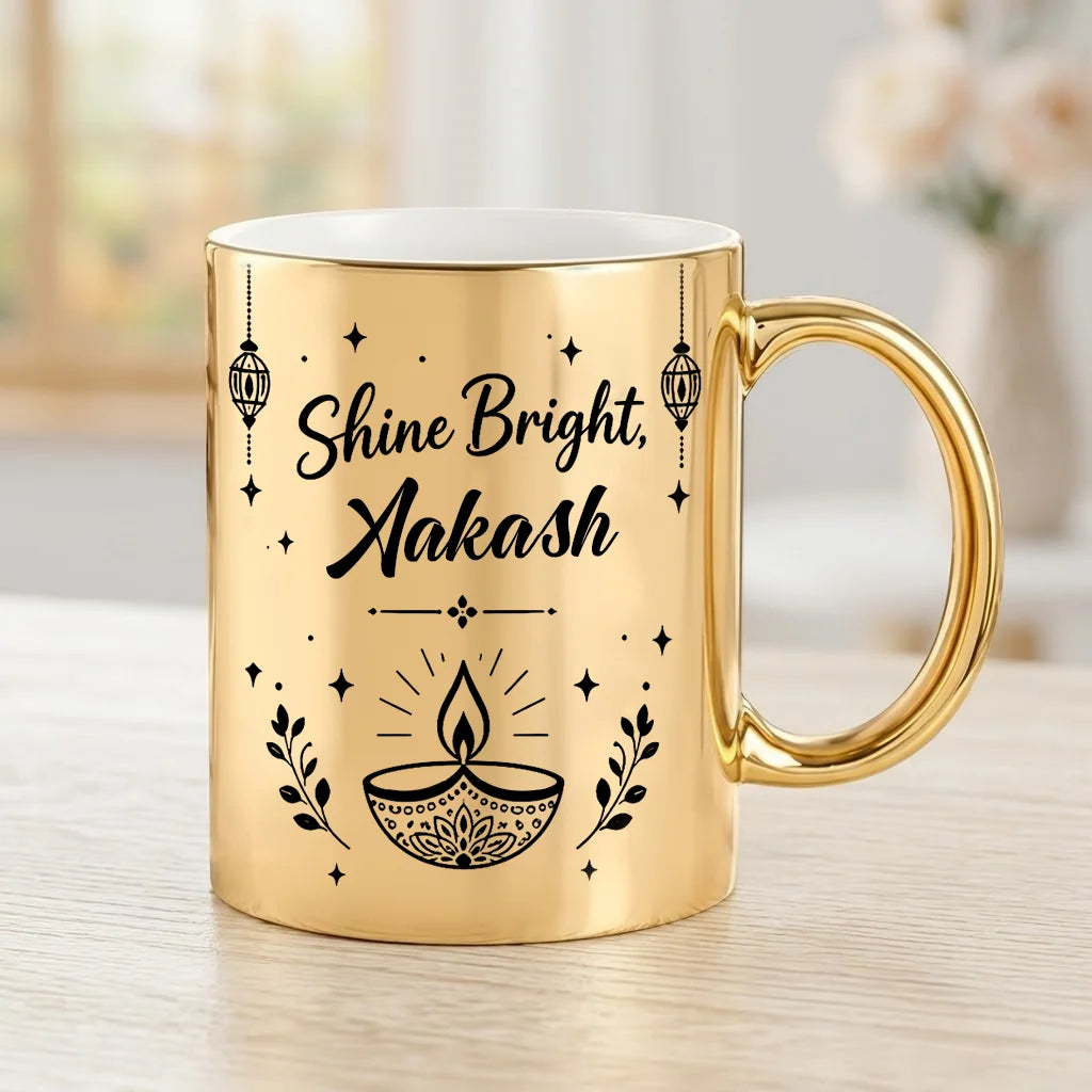 Personalized Metallic Gold Ceramic Diwali Mug with Black Diya Artwork, Lanterns, and Custom Name Script