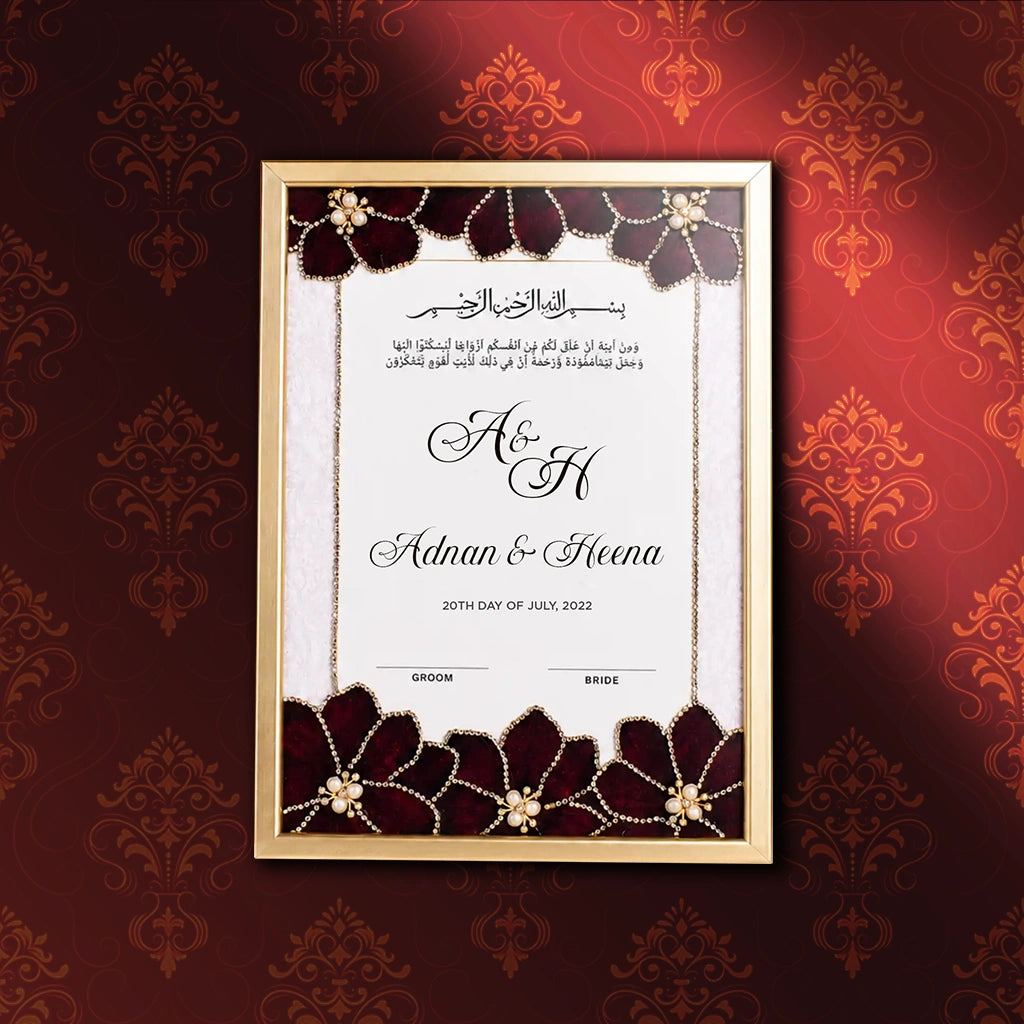 Regal Pearl Personalised Nikah Nama Frame featuring deep maroon velvet flowers, pearl embellishments, gold chain borders, Arabic calligraphy, and metallic gold frame.