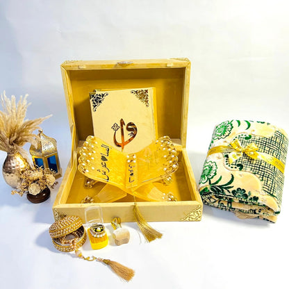Flat-lay image of golden Islamic Quran gift set with rehal, tasbih, and bookmark – ideal for spiritual gifting.