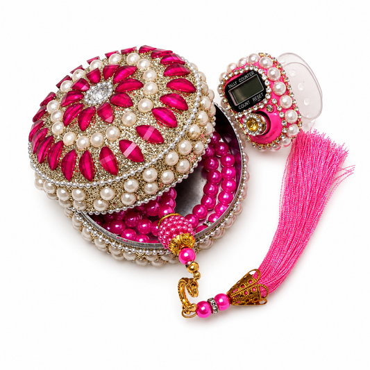 Decorative jewelry box with pink and white pearls and a matching necklace on a white background