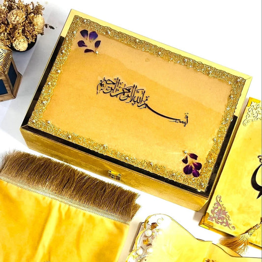 Luxury golden Islamic hamper with resin Quran stand, velvet box, and golden tasbih beads.