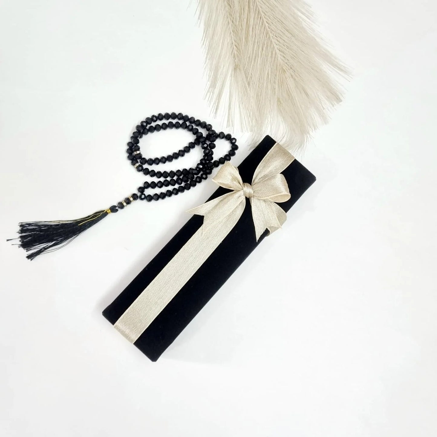 Premium Islamic gift box with crystal tasbih prayer beads and silver Bismillah bookmark.