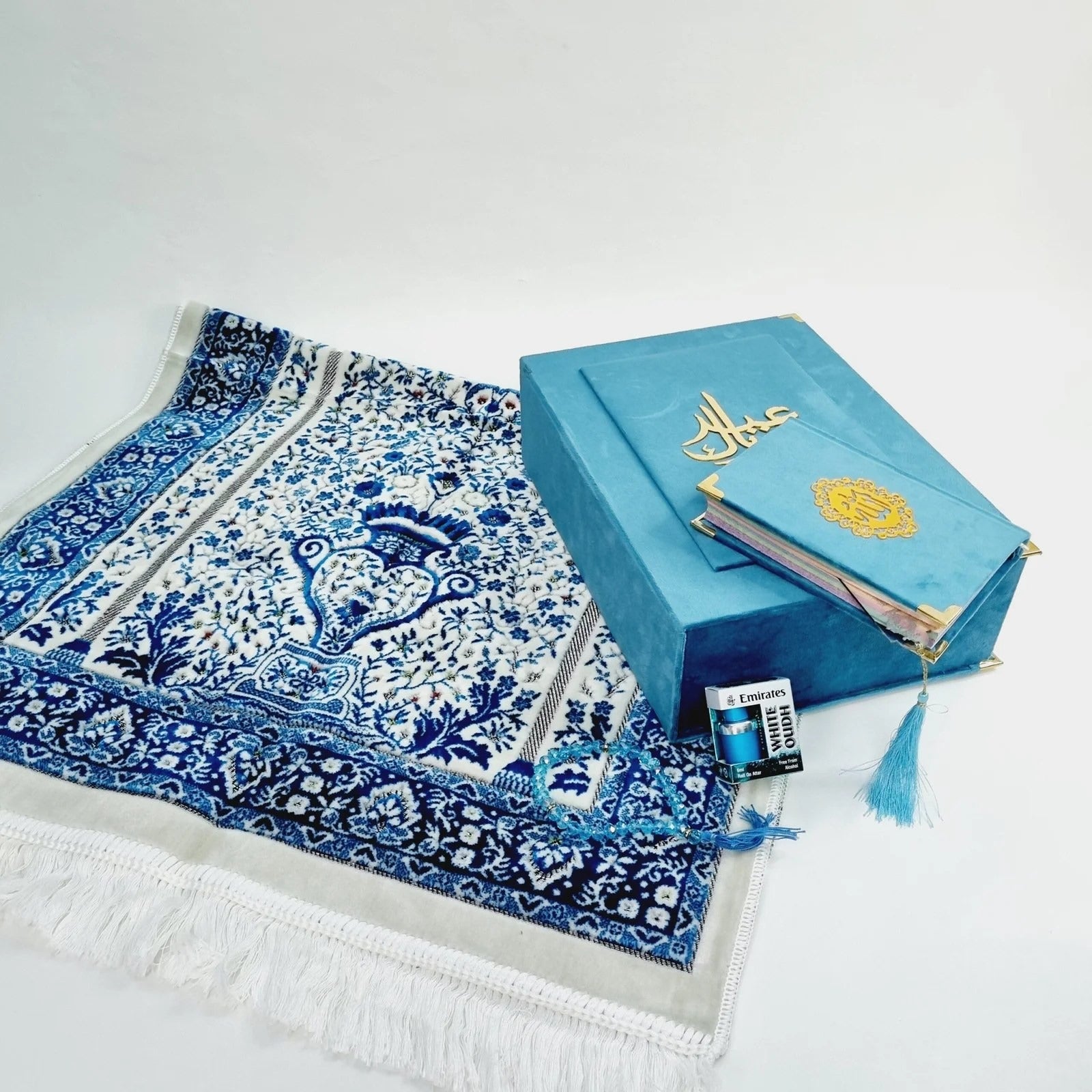 Elegant Quran and prayer mat set in a blue velvet box, ideal for Eid or Nikah gifting.