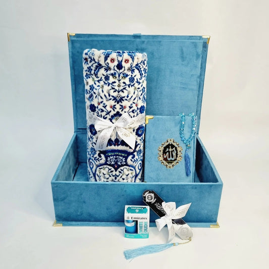 Blue velvet Quran gift set with Turkish prayer mat, tasbih, bookmark, and halal perfume.