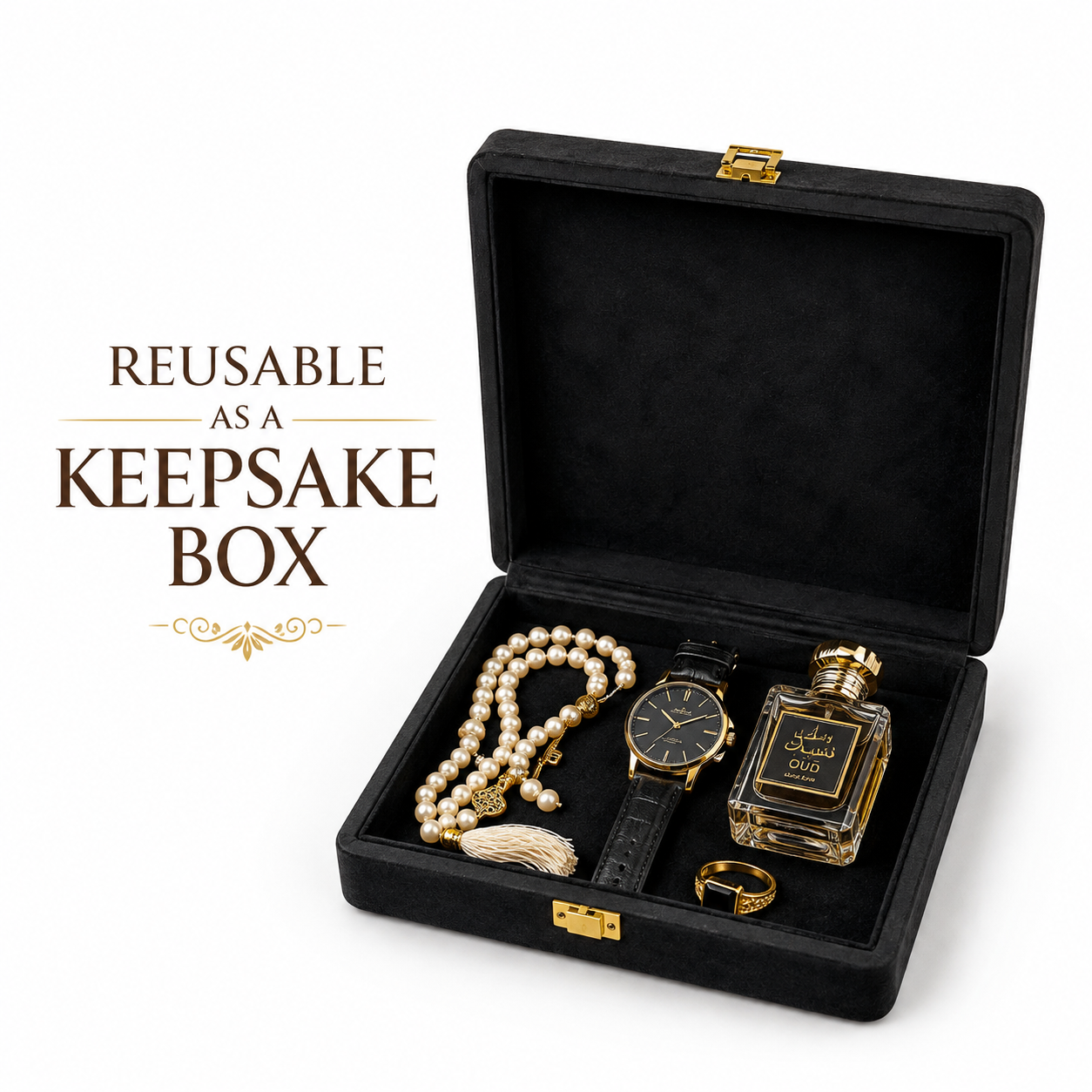 An open black velvet keepsake box with gold-tone hardware, displayed on a white background with promotional text reading 'REUSABLE AS A KEEPSAKE BOX.' Inside the box are sample jewelry and watch items: a pearl strand, a black leather watch with a gold dial, a perfume bottle labeled 'OVO,' and a gold ring.