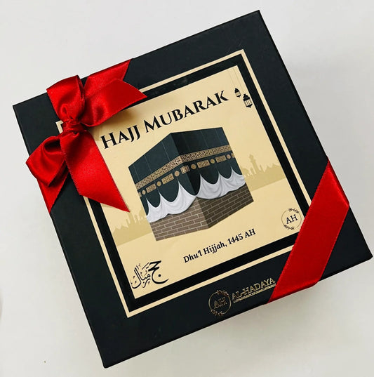 Customised Hajj Mubarak gift box with prayer mat, tasbih, dates, and Zam Zam bottle