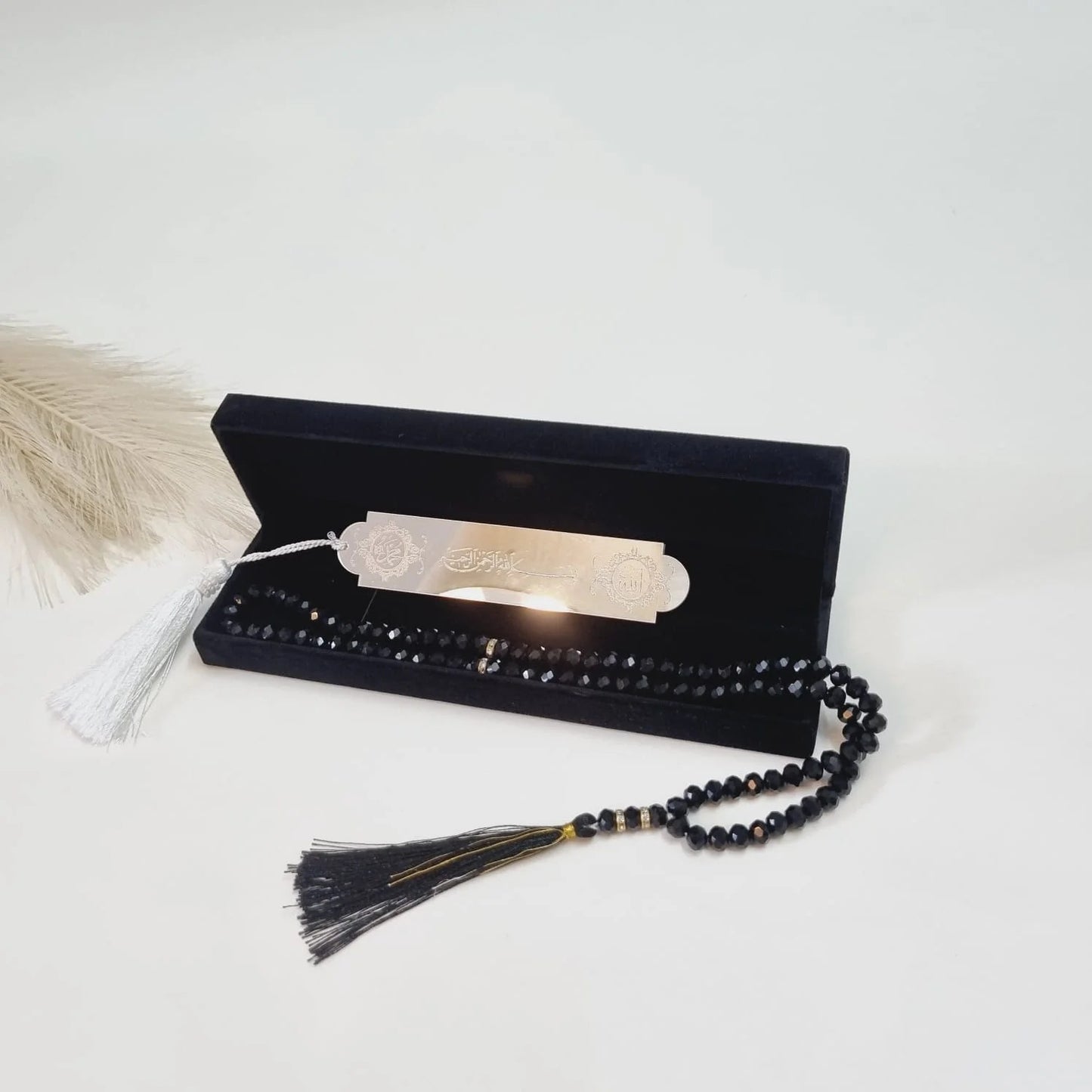 Muslim favor gift box in black velvet with tasbih and bookmark for Eid, wedding, or Ramadan.