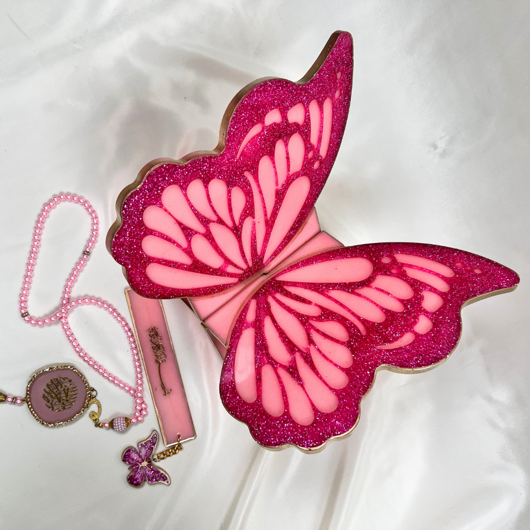 Personalized pink resin Quran rehal featuring floral detailing and butterfly motif