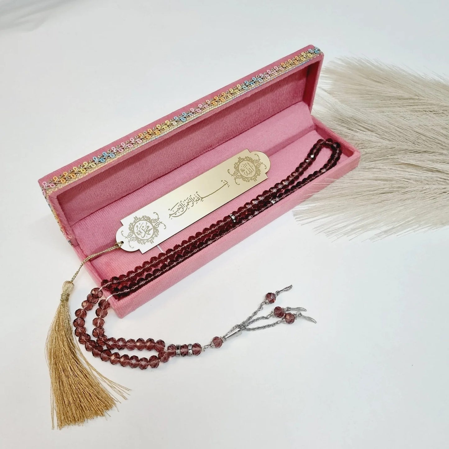 Muslim favor gift box in pink velvet with tasbih and bookmark for Eid, wedding, or Ramadan.