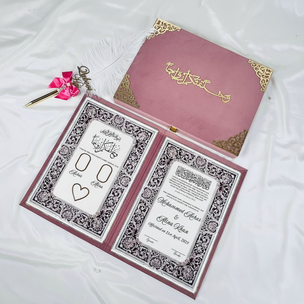 Decorative wedding invitation set with intricate designs on a white background