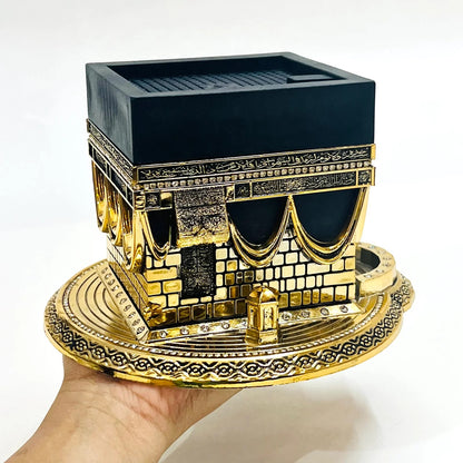 Golden Kaaba replica with Arabic calligraphy and luxury detailing.