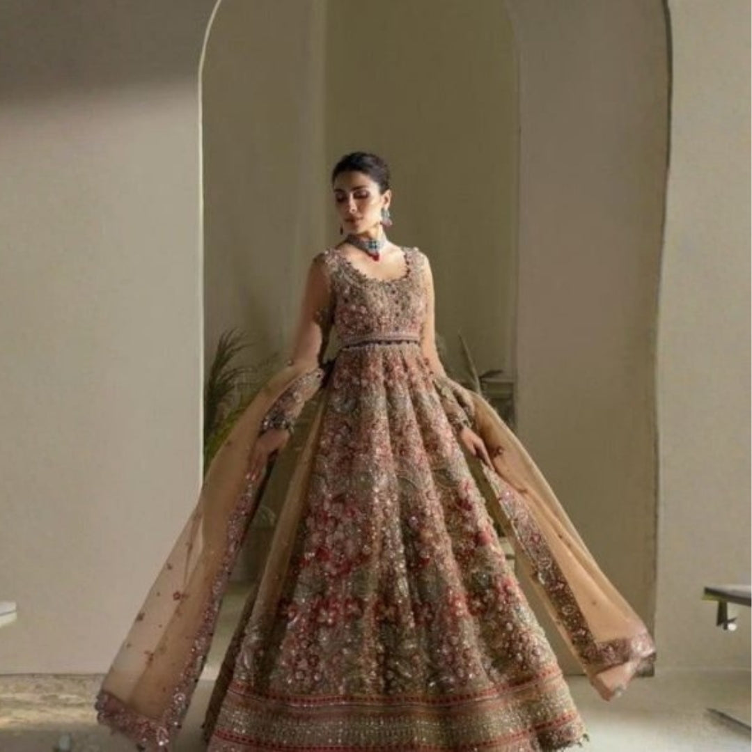 Handmade Indian wedding dress with embroidered lehenga choli and embellished details.