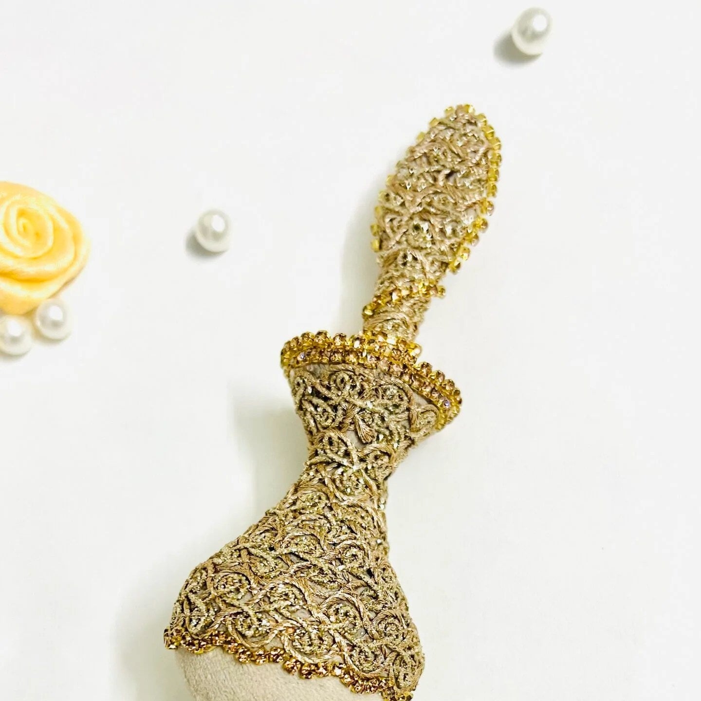 Handmade Zahra Surmadani in ivory velvet with golden detailing for wedding ceremonies.