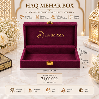 An open HAQ MEHAR BOX by Al-Hadaya in deep burgundy velvet with gold hardware, shown on a marble surface with decorative floral and lantern props. The image includes dimension labels (length 20 cm, height 5.
