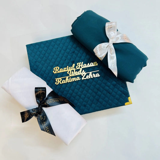 Emerald green Islamic couple gift box with tasbih, perfume, hijab, and men’s scarf.