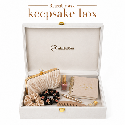 An open keepsake box set displayed on a white background with text at the top reading 'Reusable as a keepsake box.' The box is light beige/ivory with gold-tone hardware and the brand name AL-HADAYA printed inside the lid.