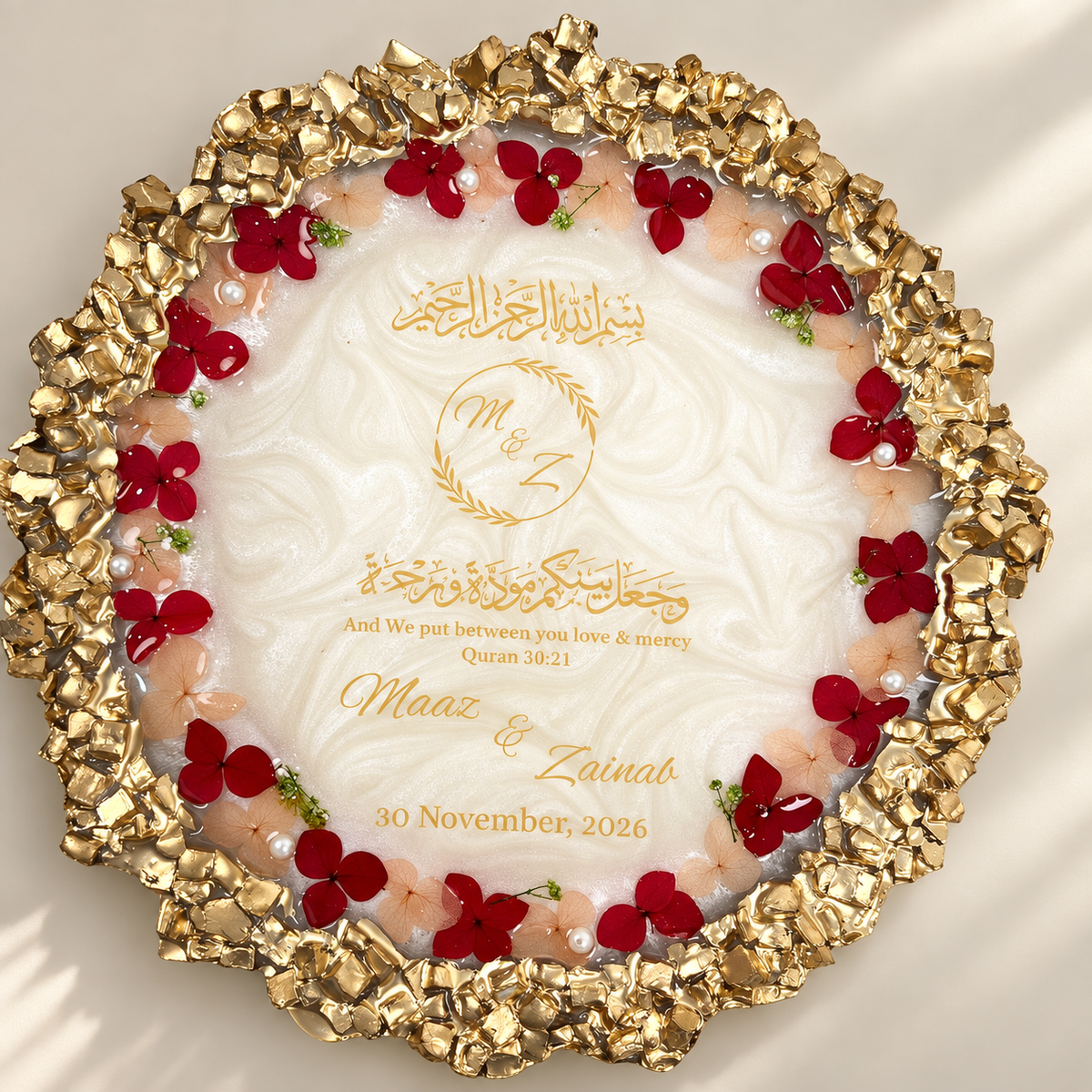 Premium personalized Nikah resin plaque featuring a pearlescent white center, intricate gold textured border, red and blush dried flowers, pearls, Arabic calligraphy, couple’s names and wedding date.