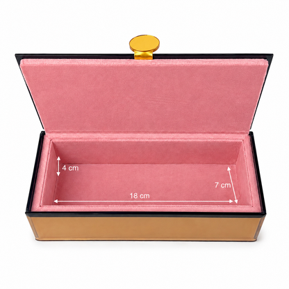 An open rectangular jewelry box with a pink velvet interior, black outer trim, a gold clasp on top, and white dimension arrows showing measurements of 18 cm length, 4 cm height on the left, and 7 cm height on the right, on a white background.