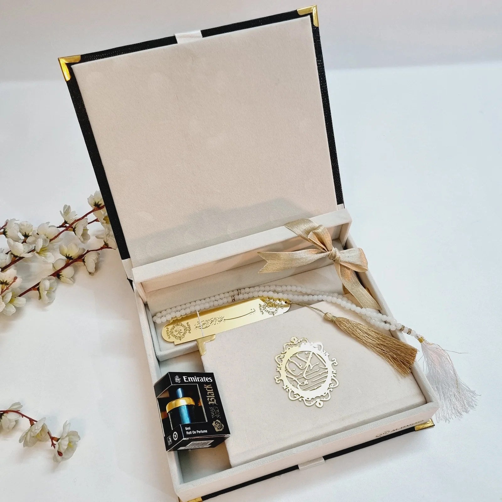 Luxury Islamic gift hamper with velvet Quran, halal oud perfume, and white pearl tasbih.