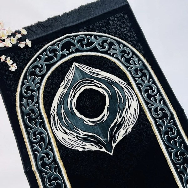 Soft chenille adult prayer mat with intricate Hajr-e-Aswad design.