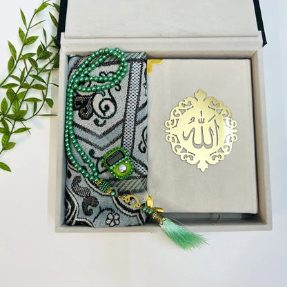 Luxury Islamic gift box in textured bottle green with velvet Quran and travel prayer rug.