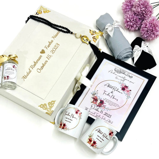 “Luxury Islamic couple hamper box in velvet off-white with personalized mugs, frame, and Zamzam bottles”