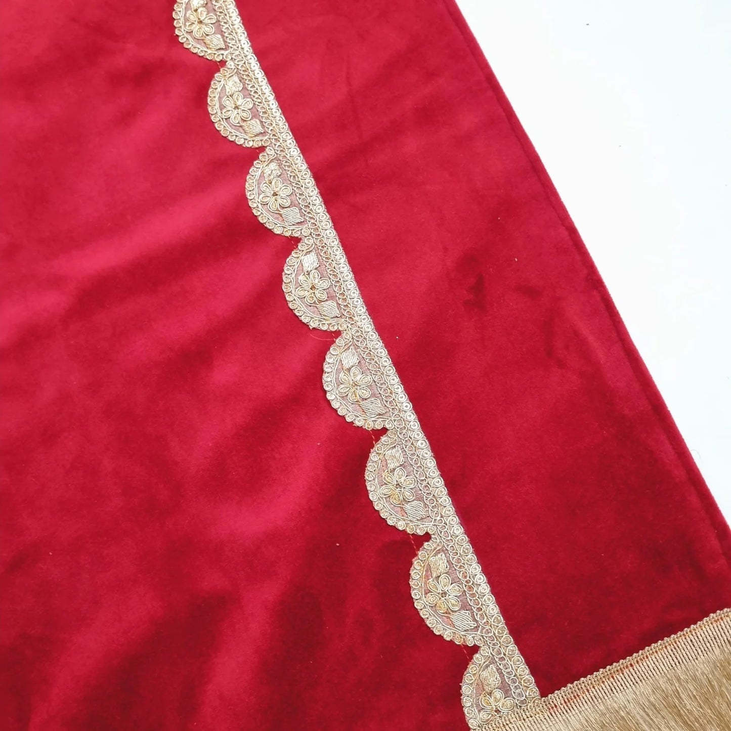 Personalized Islamic prayer mat in maroon with gold detailing and fringed edges.