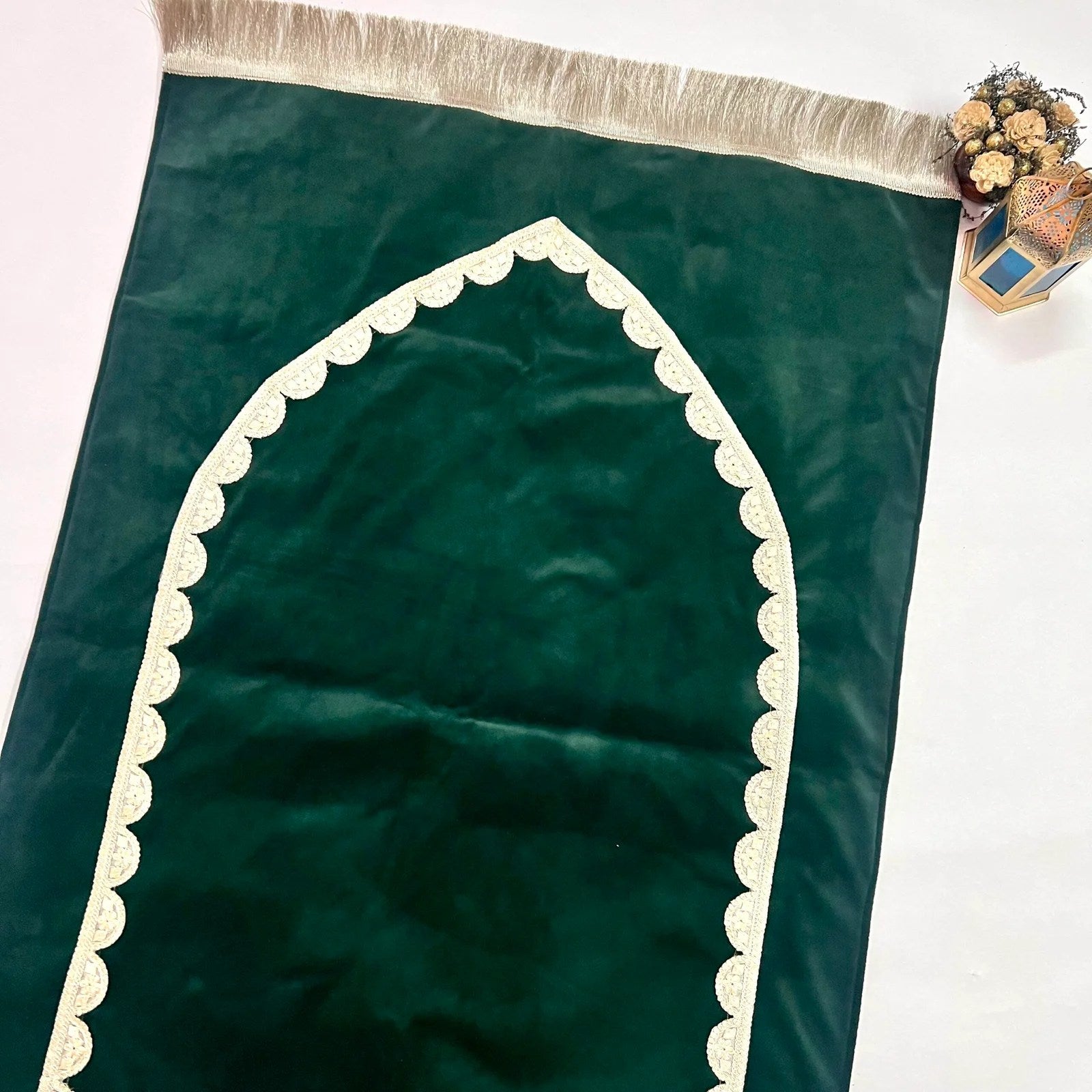 Personalized Ibadat Essentials velvet prayer mat with golden lace edges.