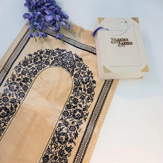 Luxury velvet Turkish prayer mat in golden yellow with blue floral pattern.