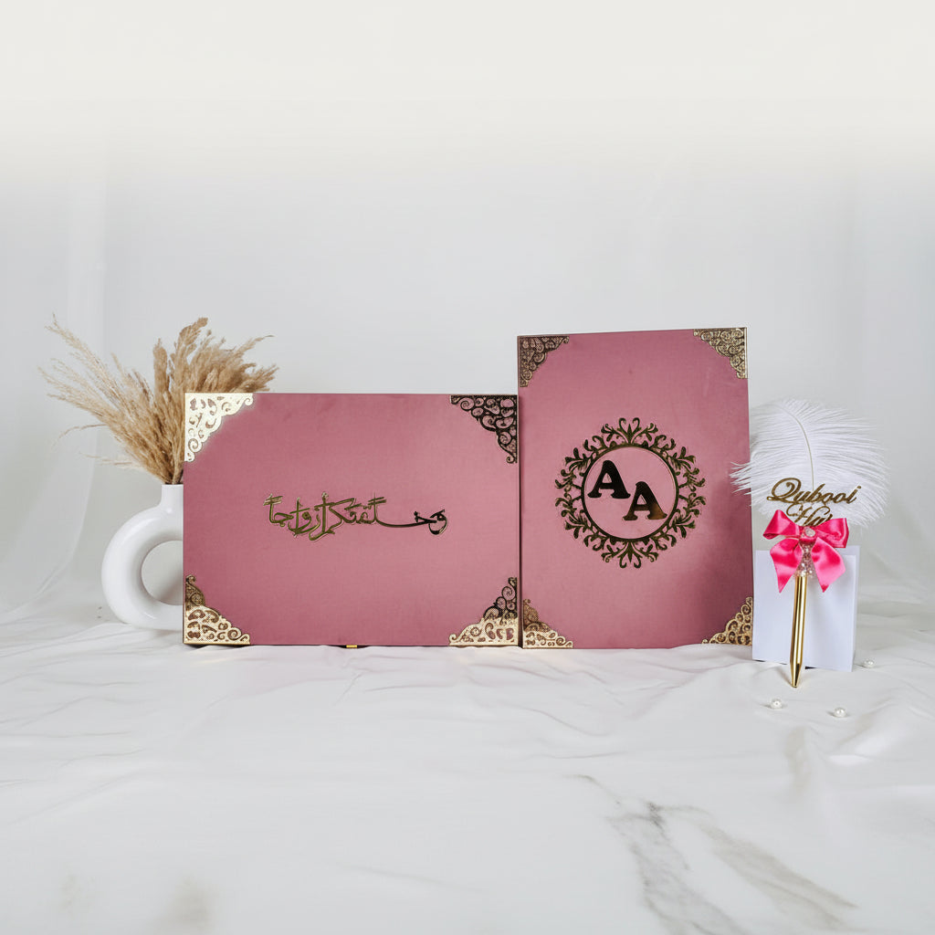 Two pink boxes with decorative elements on a white surface
