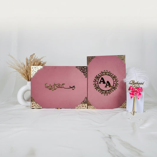 Two pink boxes with decorative elements on a white surface
